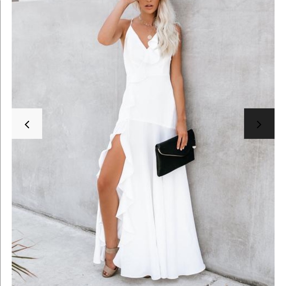 White dress with ruffles and front slit